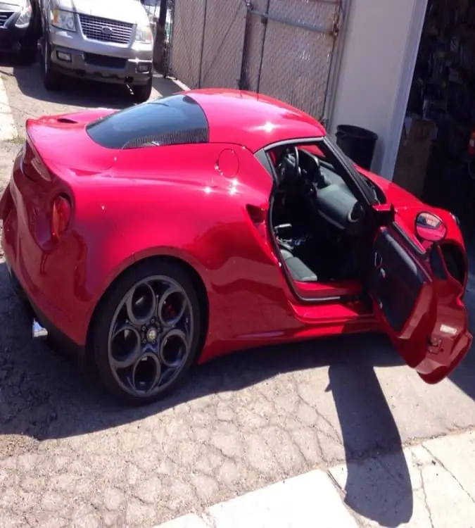 Red Alfa Romeo 4C with the door open