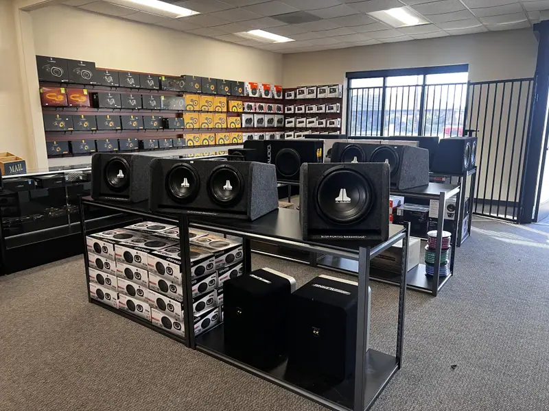 Subwoofer enclosures and a speaker wall inside the store
